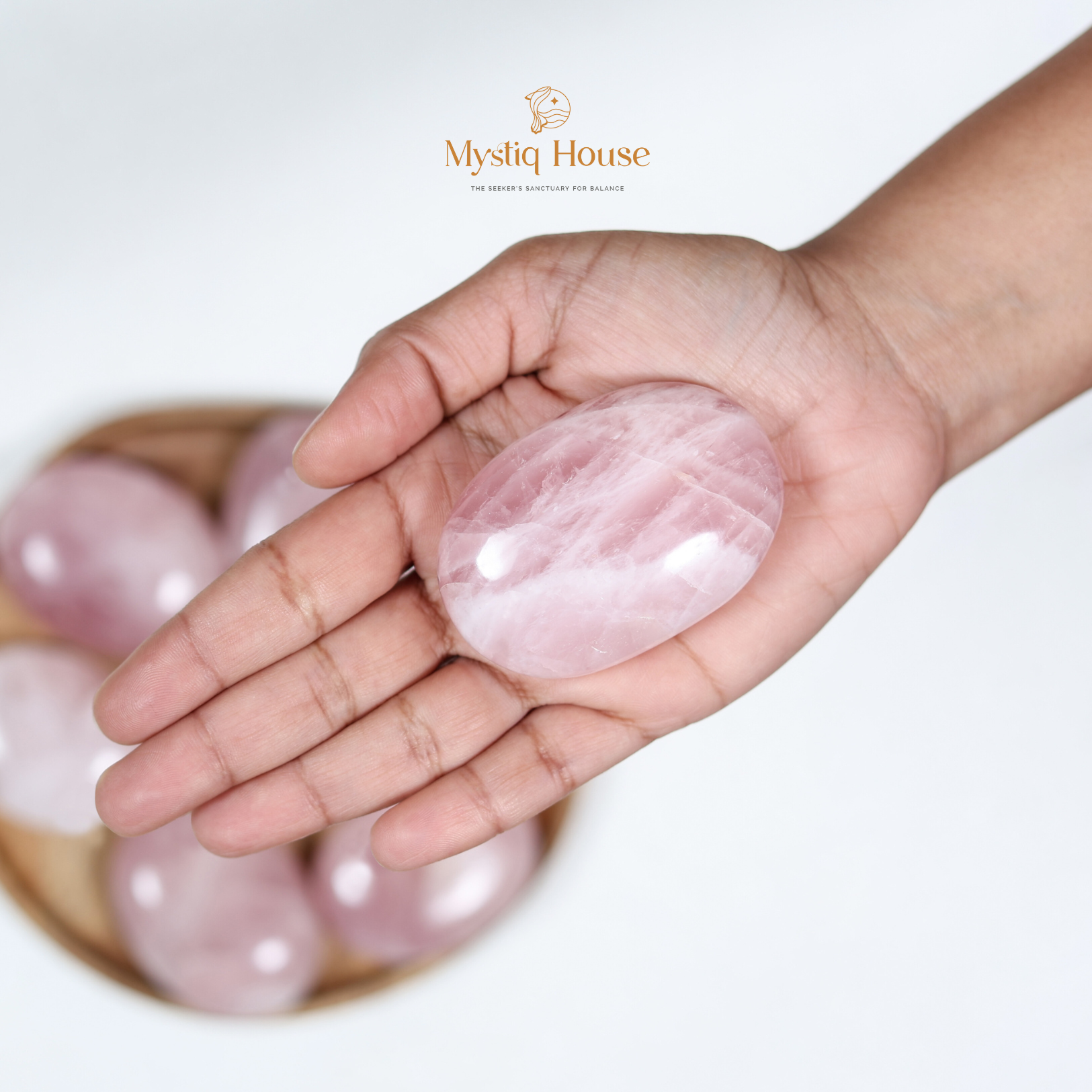 Mystiq House Rose Quartz palm stone In hand